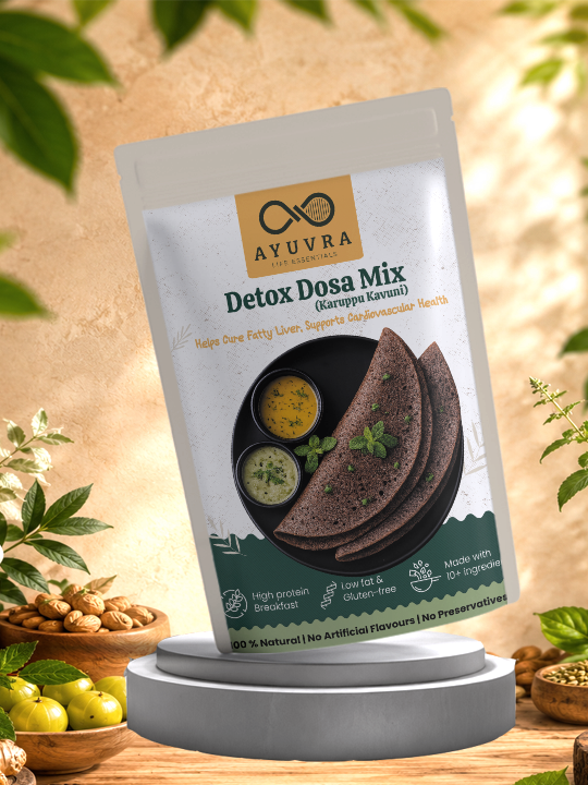 Packaging of Ayuvra Detox Dosa Mix on a wooden surface with greenery in the background