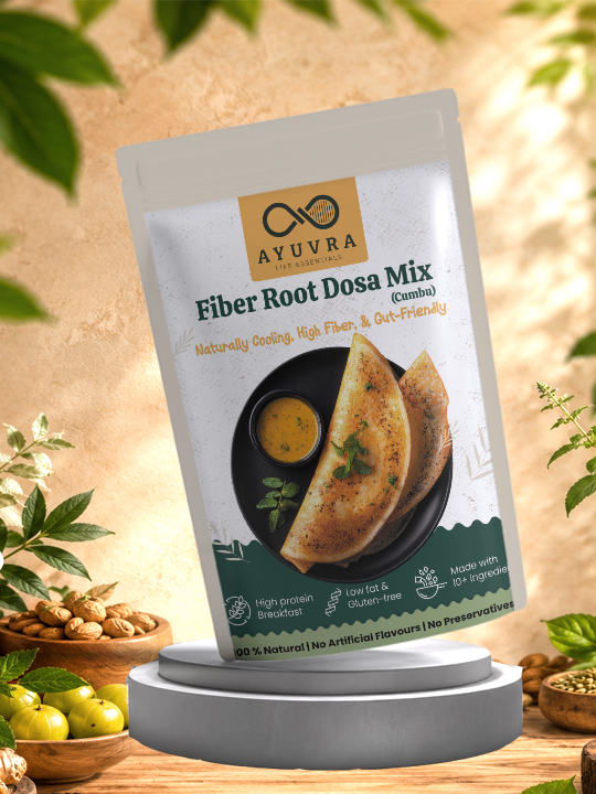 Packaging of Ayuvra Fiber Root Dosa Mix with a background of green leaves and wooden bowls.